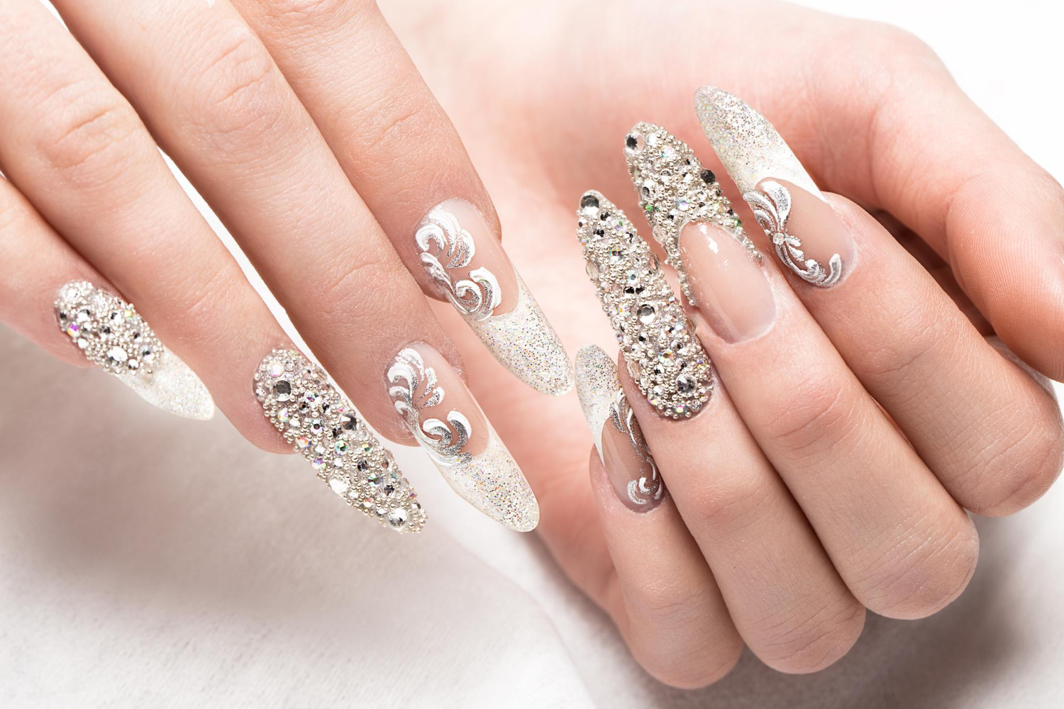 beautifil-wedding-manicure-bride-gentle-tones-with-rhinestone-nail-design-close-up