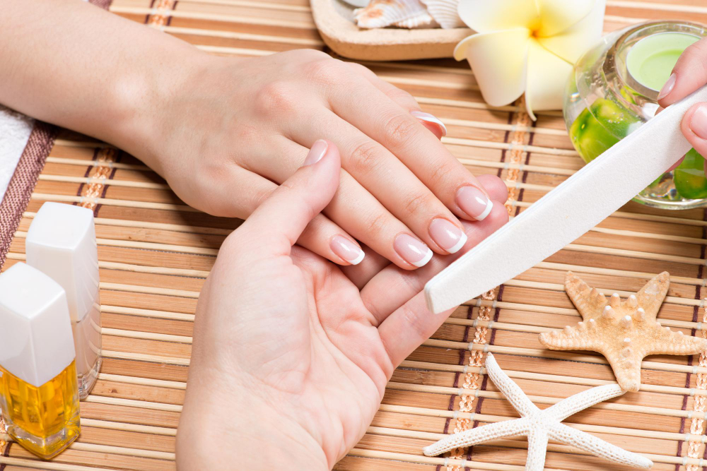 woman-nail-salon-receiving-manicure-by-beautician-beauty-treatment-concept